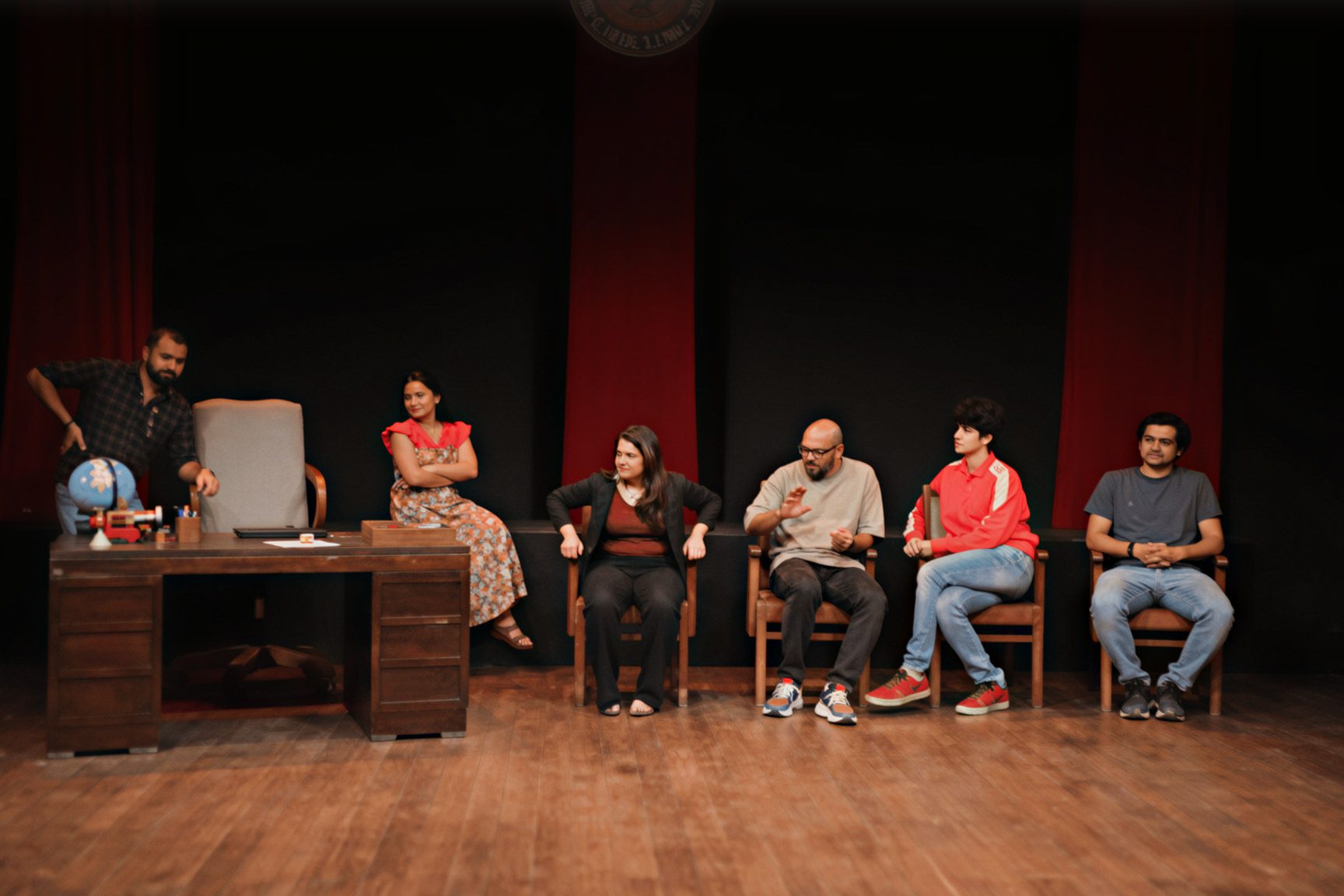Adult actors rehearsing on stage at Rangshila Theatre Group