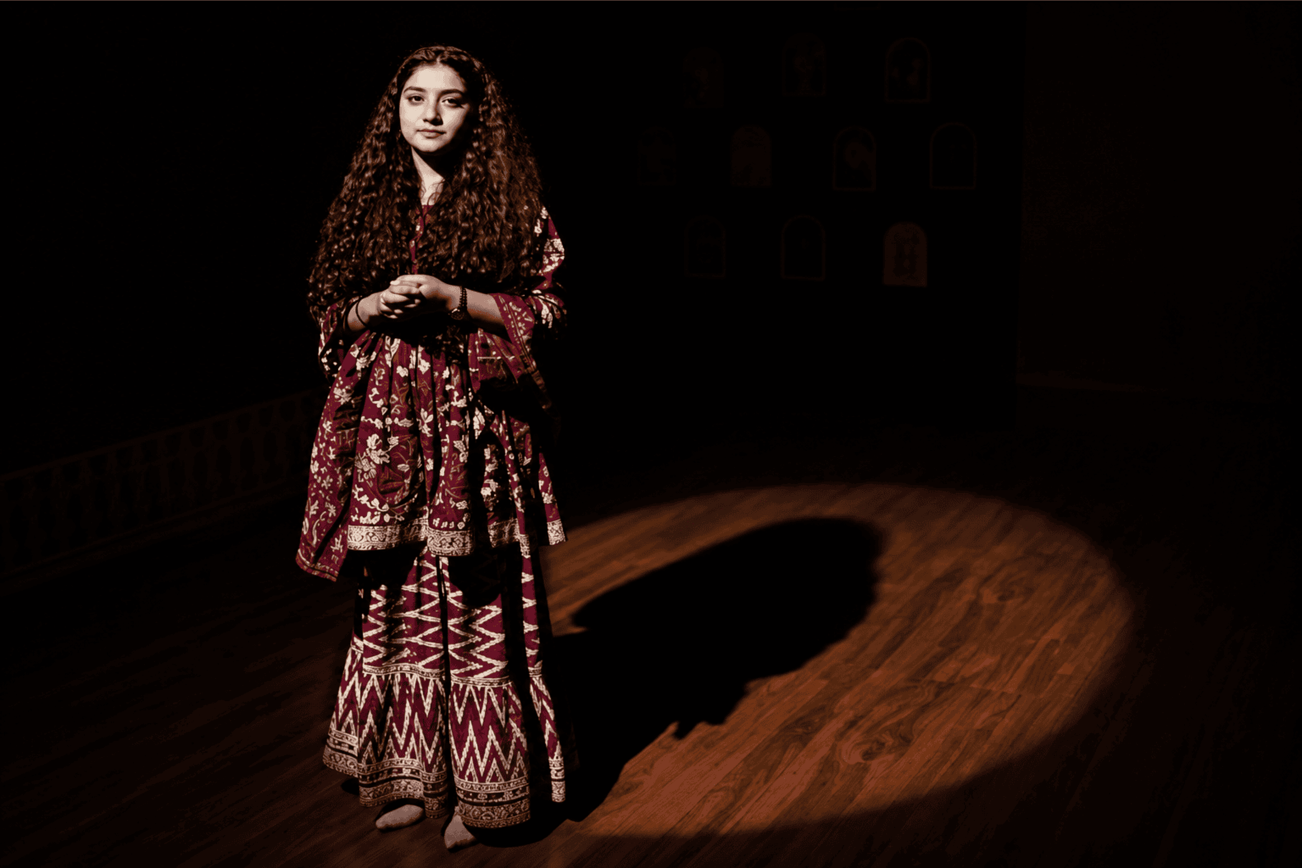 Solo actor performing a monologue under a spotlight at Rangshila Theatre Group in Mumbai.