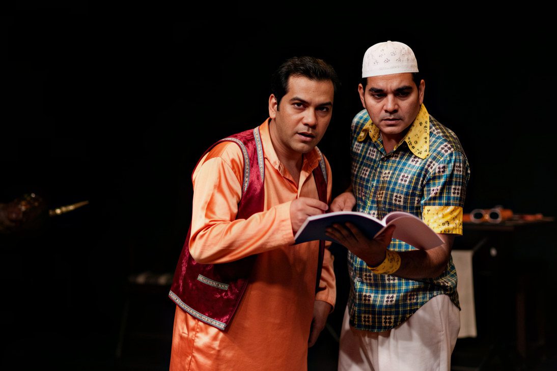 Young actors reviewing an acting contract and discussing its terms before signing.
