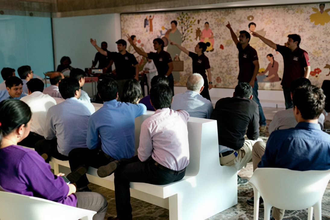Students observing a theatre workshop during an acting school visit