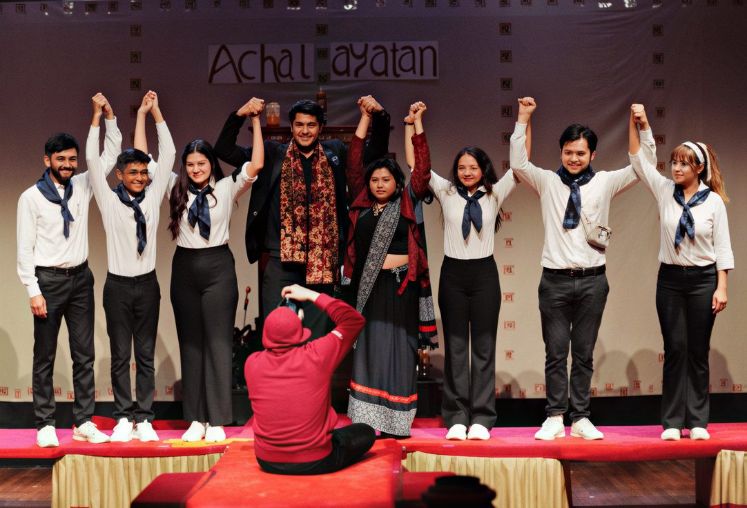 Audience watching a live theatre performance on stage